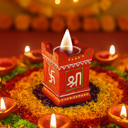 Close-up of colorful handcrafted clay diya with Shree symbol for festivals and pooja