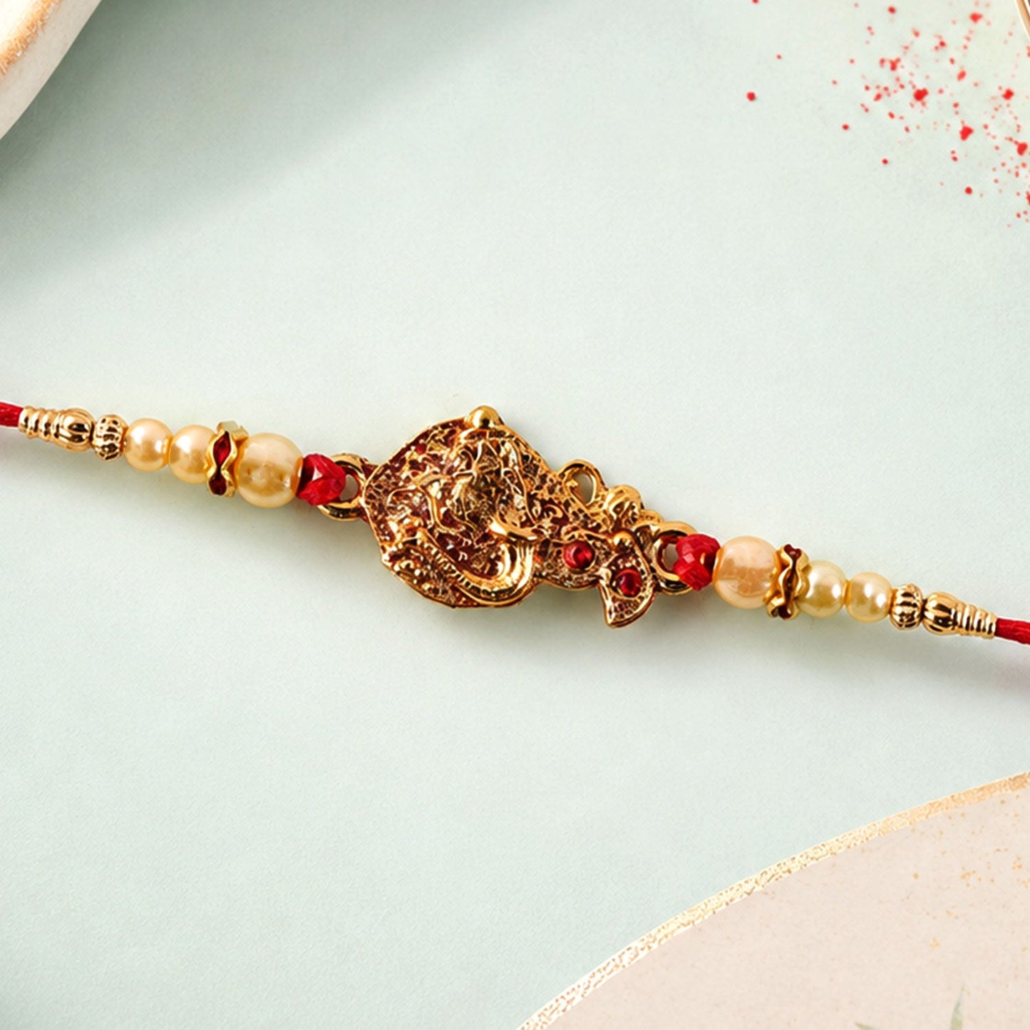 Golden Peacock Rakhi Pearl Beads & Red Thread for Brother on Raksha Bandhan (10pcs)