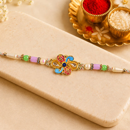 Ornate Rakhi featuring Petal Blossom Charm and bead line in gift style for Gift Use