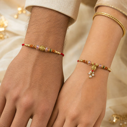 Couple Rakhi with Crystal Beads, Gold Cube Charm and Pearl Drop
