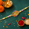 Orange and Green Enamel Flower Pendant Rakhi with Kundan Teardrop Stones