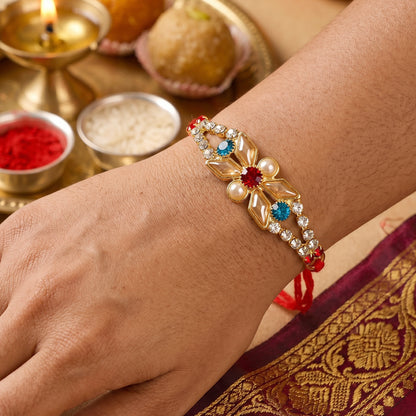 Pastel Floral Kundan Rakhi with Blue Stone and Pearl Center