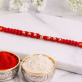 Red Stone Rakhi – Minimal Design with Fine Beads & Festive Thread
