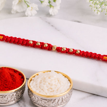 Minimal Red Stone Rakhi with Simple Beauty, Fine Beads and Festive Thread Detail