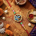 Traditional Divine Shree Ram Rakhi – Golden-Plated Circular Dial with Crystal Rhinestones
