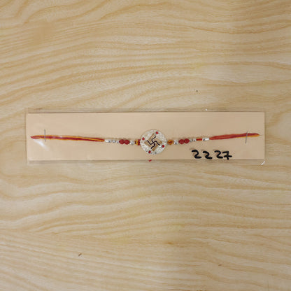 Silver Swastik Stone Rakhi with Red Thread and Handmade Look