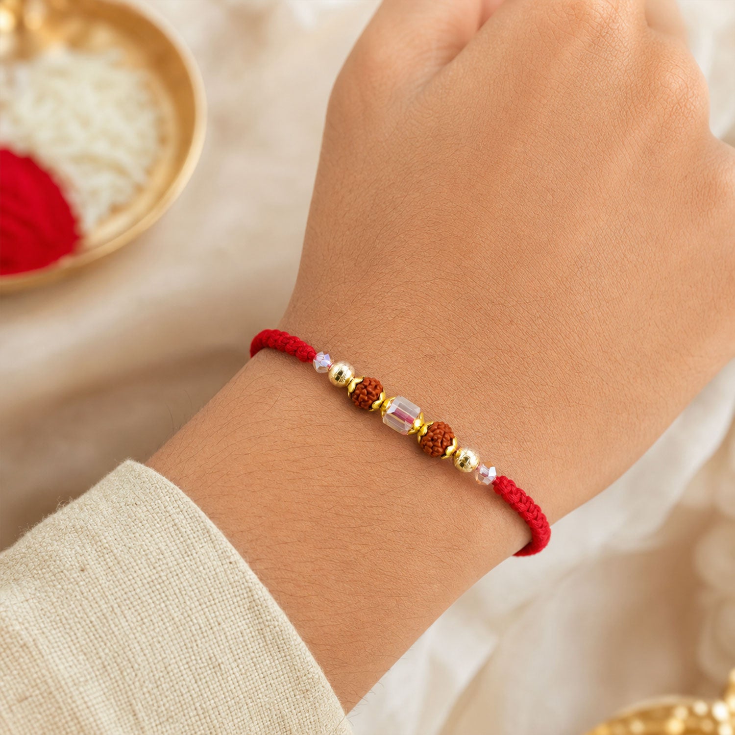 Red Thread Rakhi with Textured Rudraksha and Crystal Bead Pendant