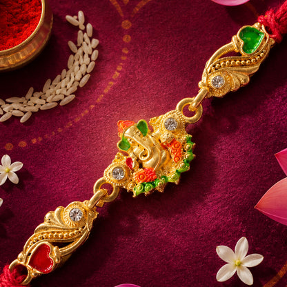 Gold-Toned Lord Ganesha Rakhi with Orange-Green Enamel, Crystal Accents & Red Thread