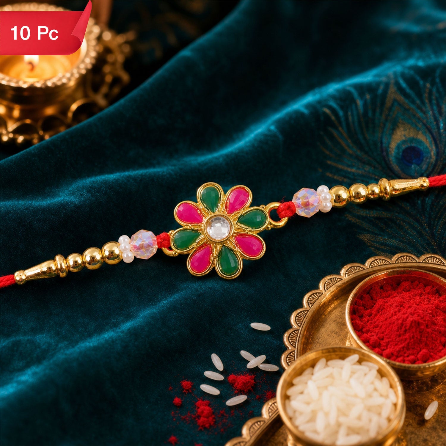 Radiant Floral Rakhi Adorned with Pink-Green Stones, Pearls and Gold-Tone Beads (10pcs)