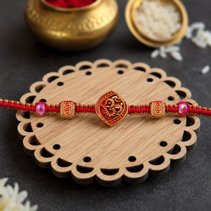 Red Swirl Stone Rakhi with Golden Detail and Beautiful Festive Centre Styling