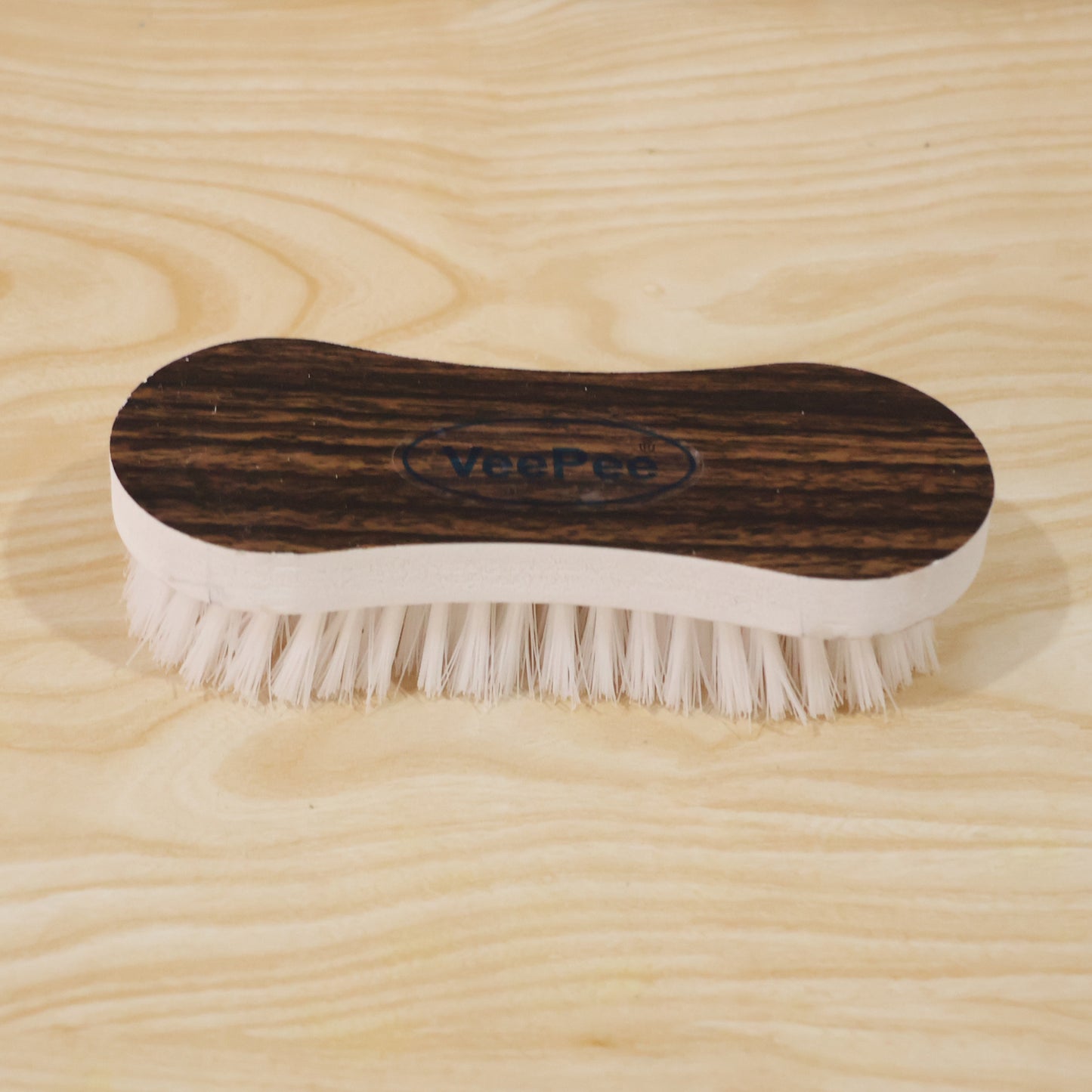 Curved Laundry Brush Wooden Background