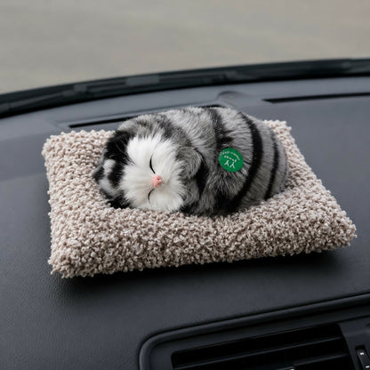 Sleeping cat plush toy on cushion for car dashboard