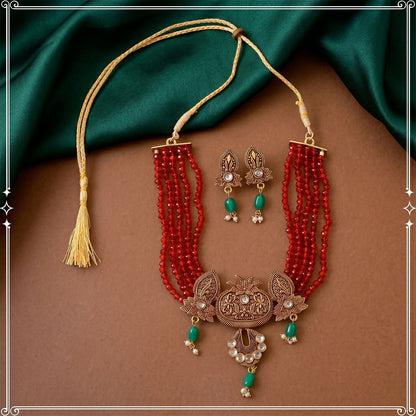 Adjustable thread closure on maroon beaded necklace