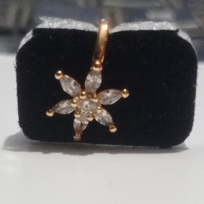 Gold-plated floral nose stud with clear gemstones on white background