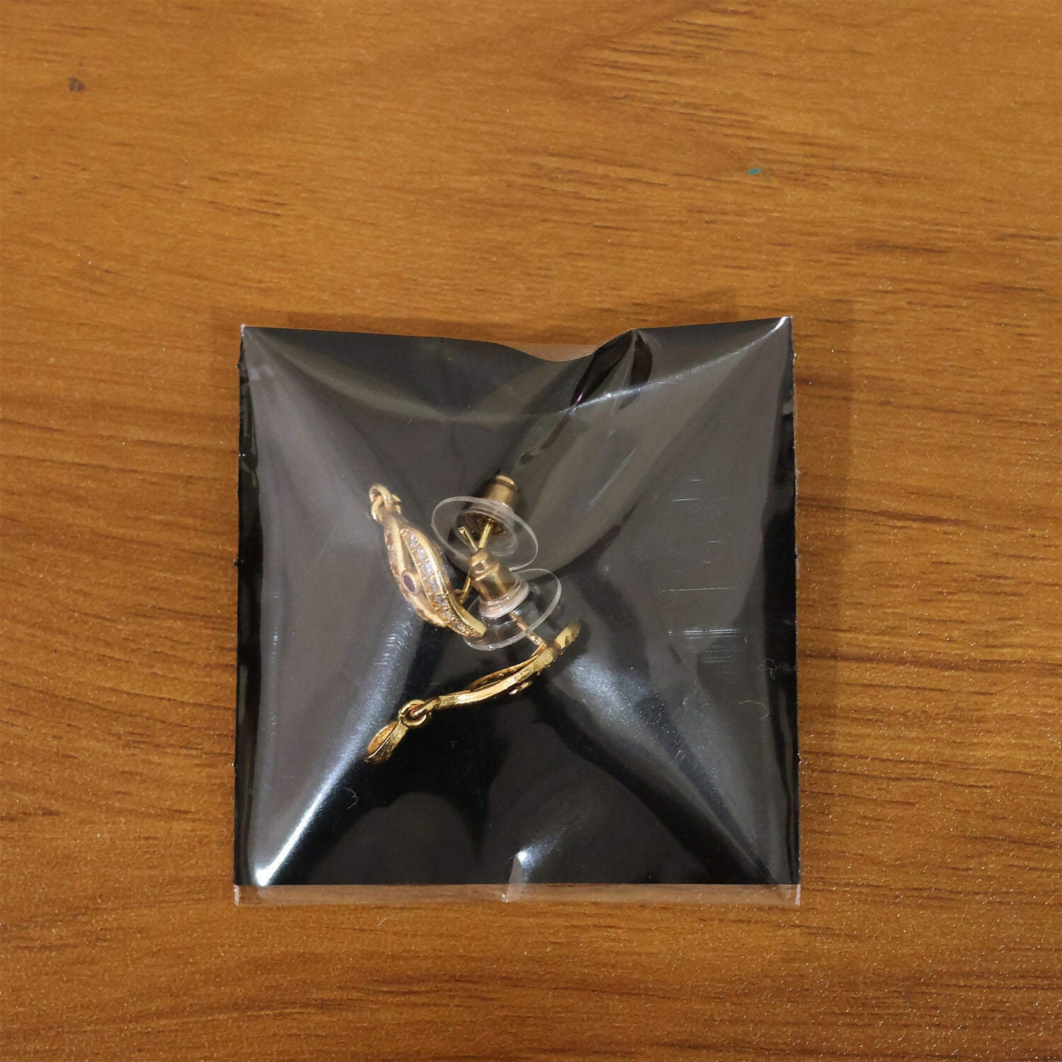 Star Cut Pattern Gold Finish Earrings With Crystal Detailing And Teardrop Charm