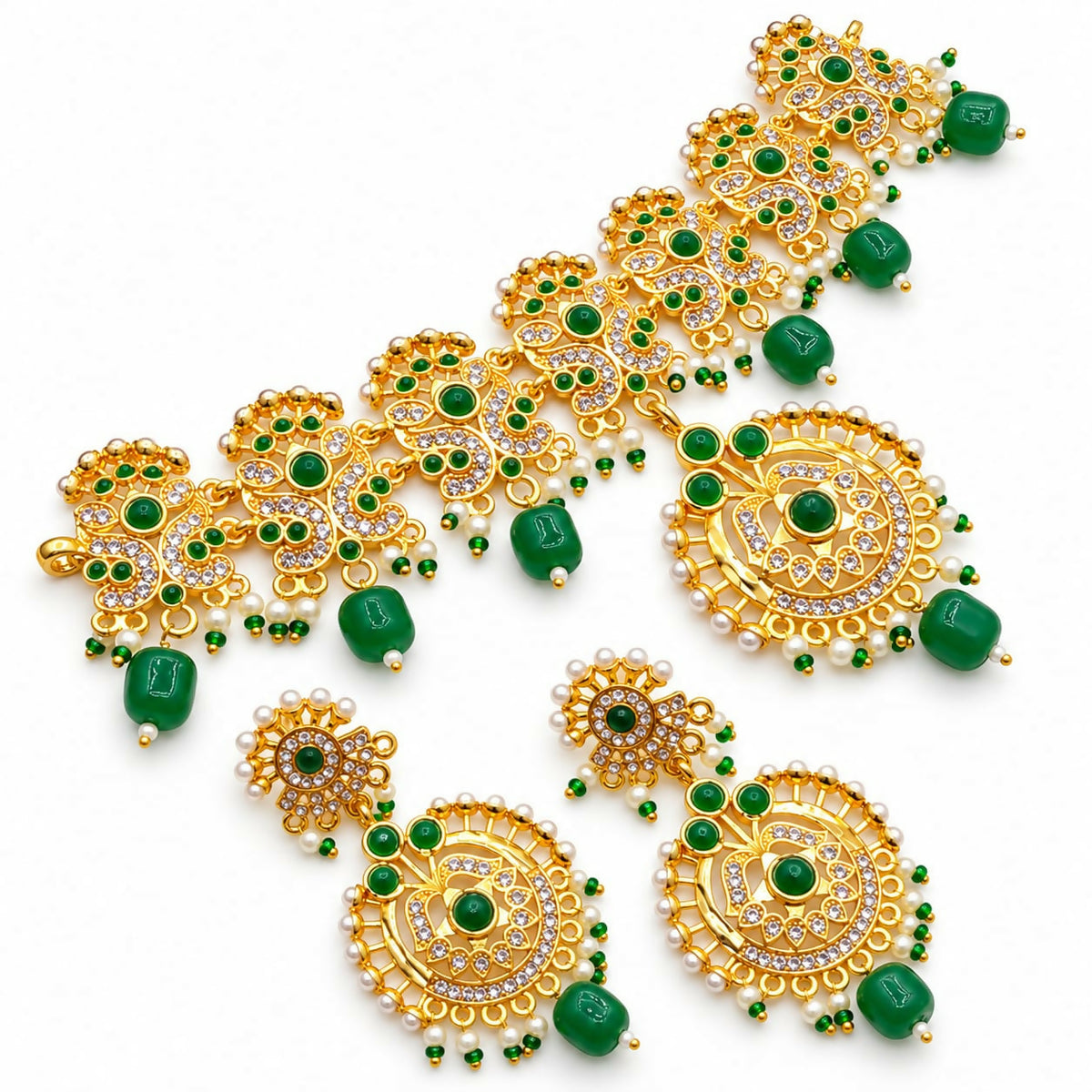 The gold-plated necklace and matching earrings, adorned with green beads and white stones, are displayed on a white