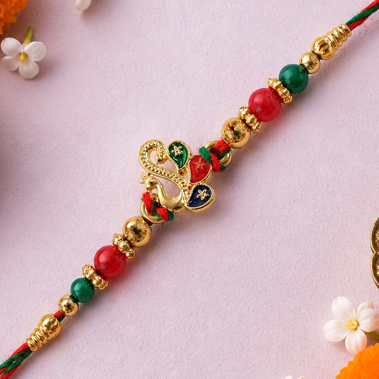 Colorful Enamel Peacock Pendant Rakhi with Red and Green Beads