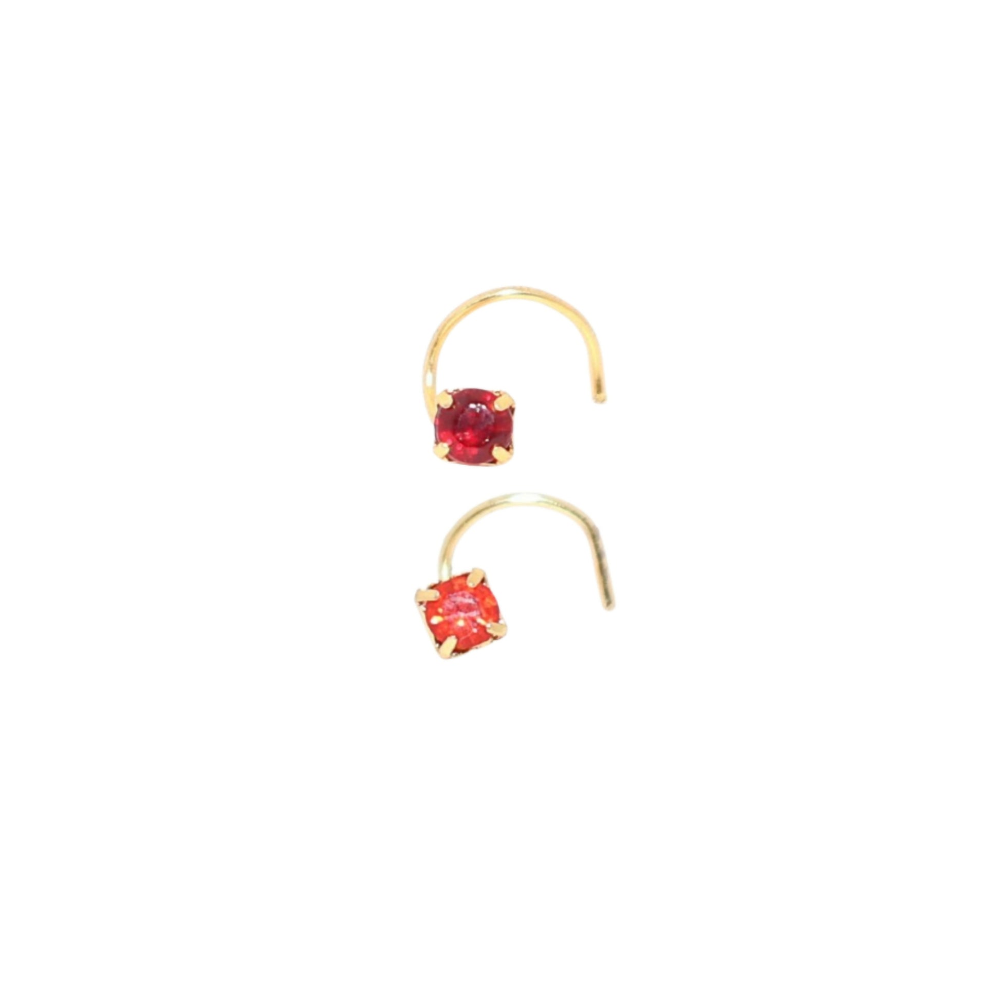Two red ruby crystal stud nosepins in deep red and bright crimson shades, gold plated.