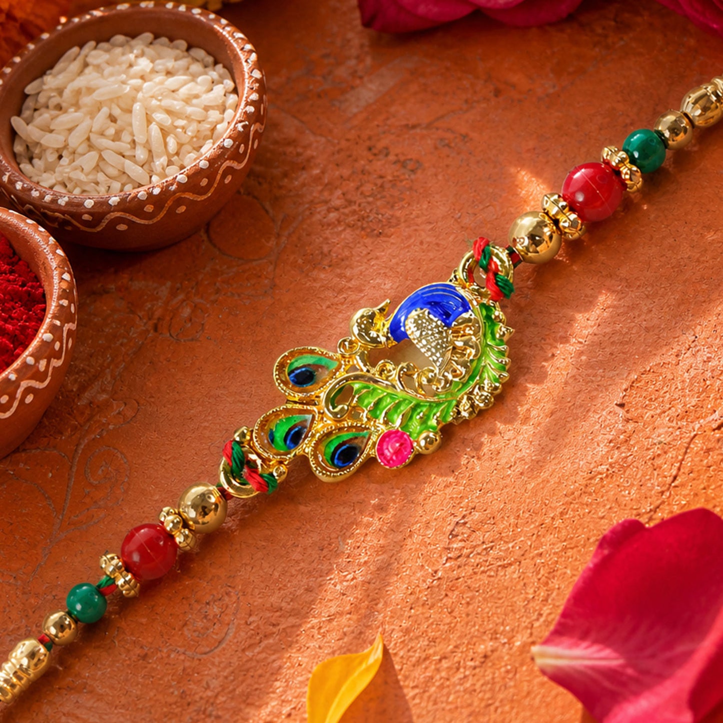 Green and Blue Peacock Enamel Pendant Rakhi with Red and Green Beads