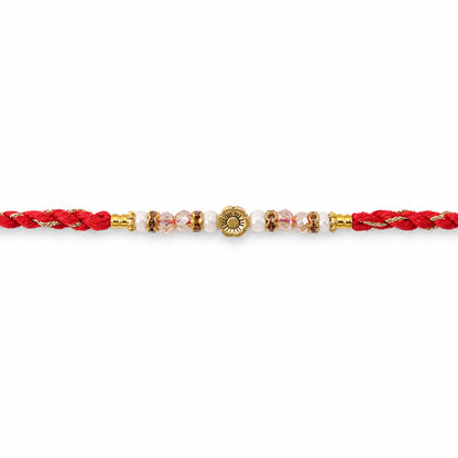 Red Thread Rakhi with Pearls, Crystal Beads and a Gold Flower Charm