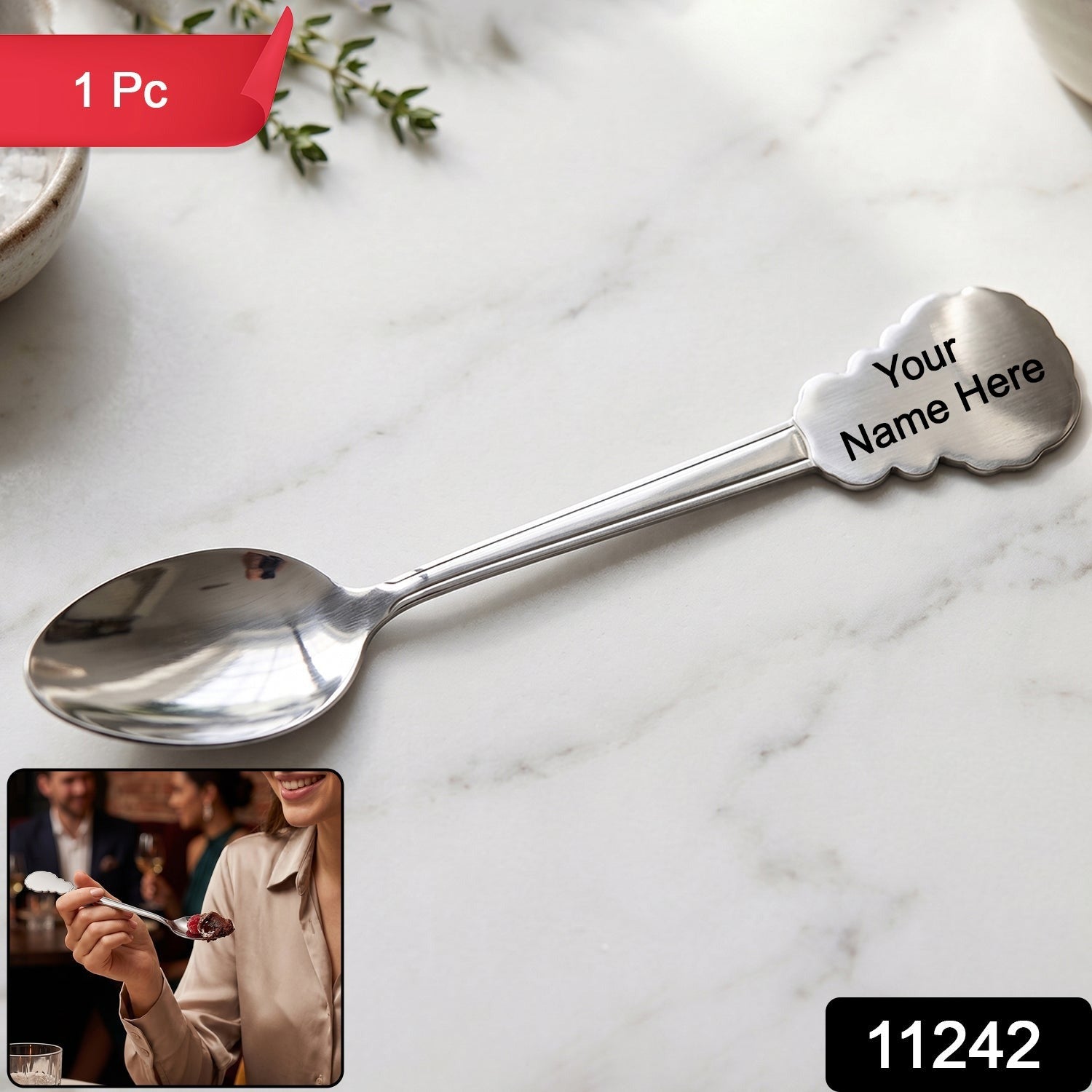 Close-up of the mirror-polished stainless steel spoon showing its intricate carved handle.