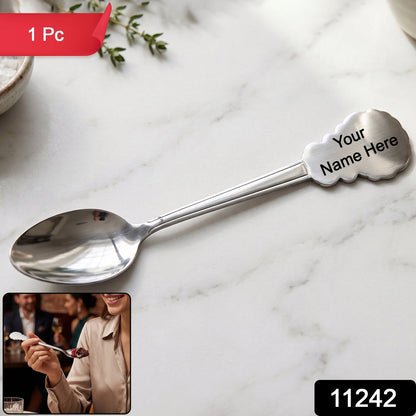 Close-up of the mirror-polished stainless steel spoon showing its intricate carved handle.