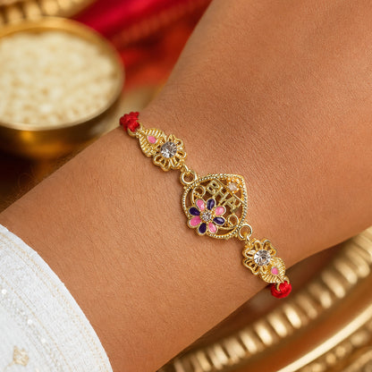 Festive Rakhi featuring Ornate Floral Charm, pearl accents and chain look for Gift