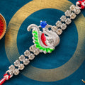 Festive Rakhi with Peacock Charm, pink accents and display look for Gift Styling