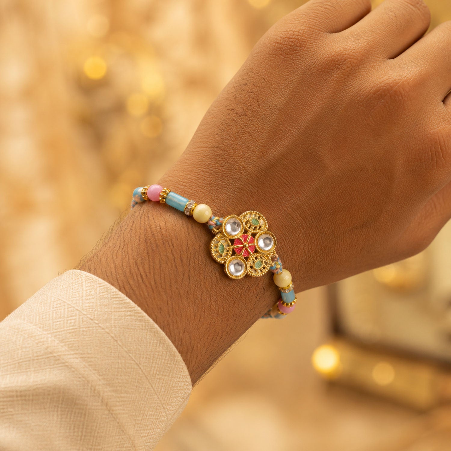 Blue Pink Floral Rakhi with Gold Medallion and Soft Festive Brother Gift Styling