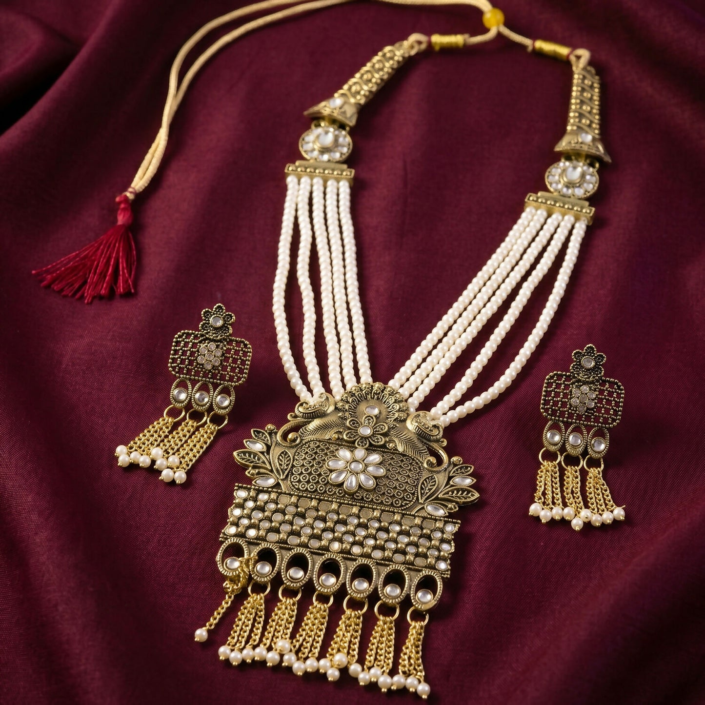 Side view of pearl necklace with gold pendant