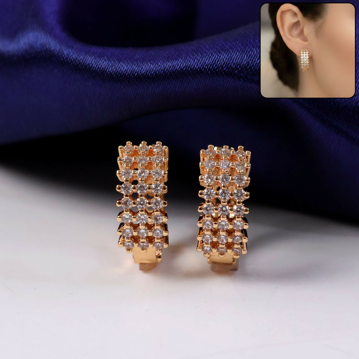 Lifestyle image of women wearing gold-tone CZ studded hoop earrings