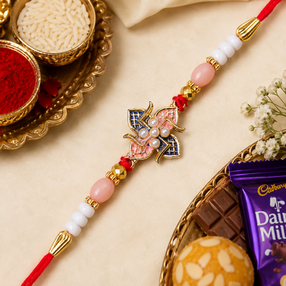 A red and white beaded bracelet with a central pink and blue floral charm is displayed on a light background with small