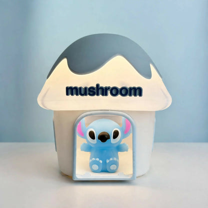 A light blue and white mushroom house night light with a glowing Stitch character, displaying the word "mushroom" on its cap.