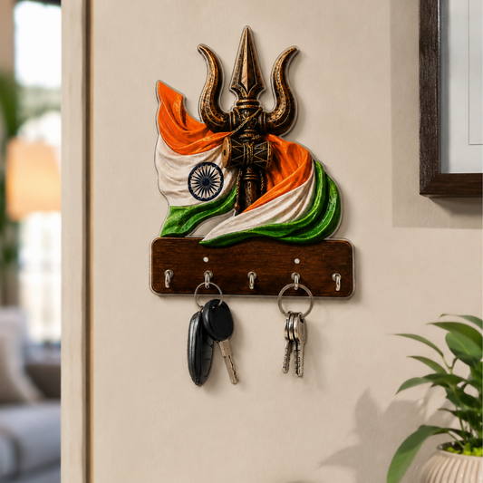 Trishul design wooden key holder with 5 metal hooks on a wall