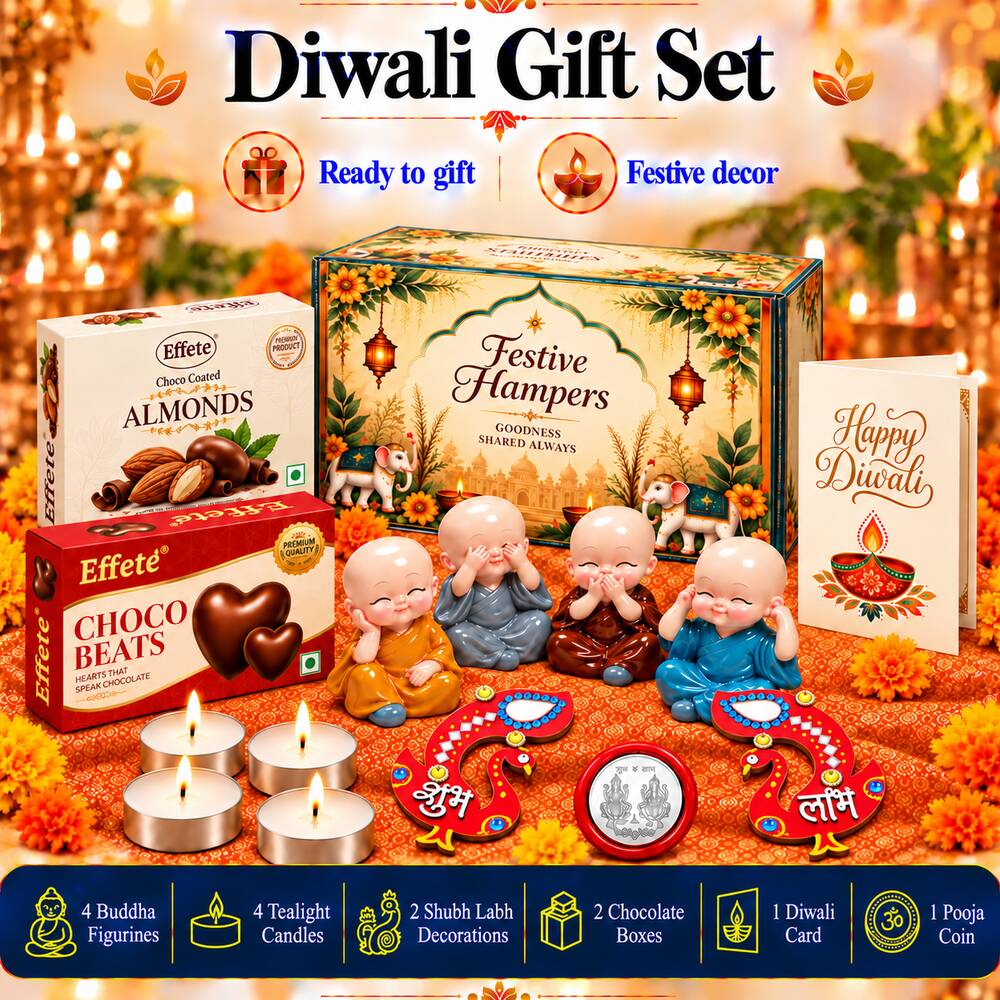 A festive hamper box with two chocolate boxes, four Buddha figurines, tealights, and decor on a white table.