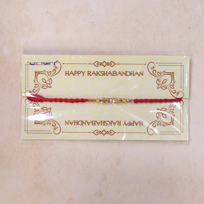 Red Thread Rakhi with Crystal Bead Pendant and Golden Bead Accents
