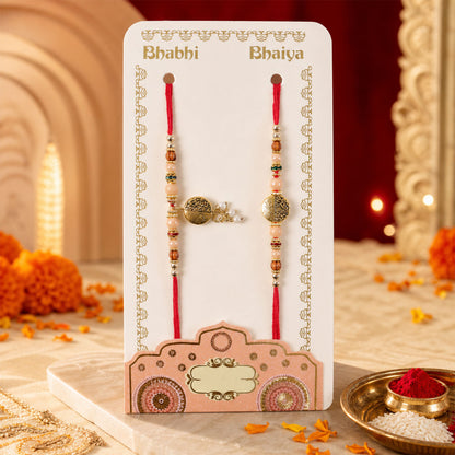 Couple Rakhi with Gold Coin Charm, Pearl Drop and Multicolor Bead Accents