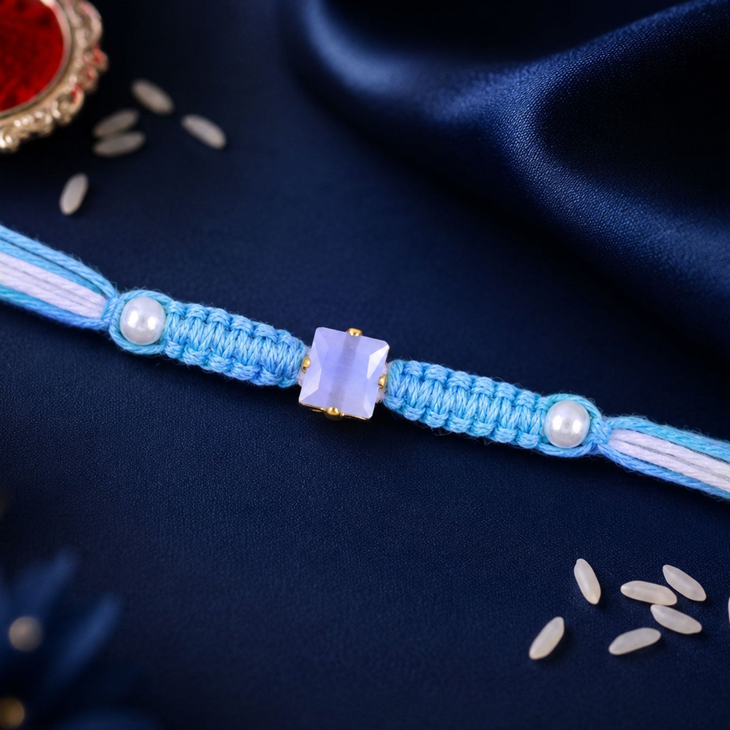 Blue Square Stone Macrame Rakhi with Pearl Beads, Silver Accents and Soft Thread