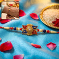 Gold Sunburst Rakhi – Elegant Tradition with Beads & Pearls