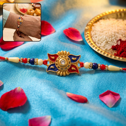 Gold Sunburst Rakhi with Blue Red Beads and Pearl Accents