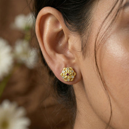 Elegant gold earrings with crystal embellishments in a triangle pattern