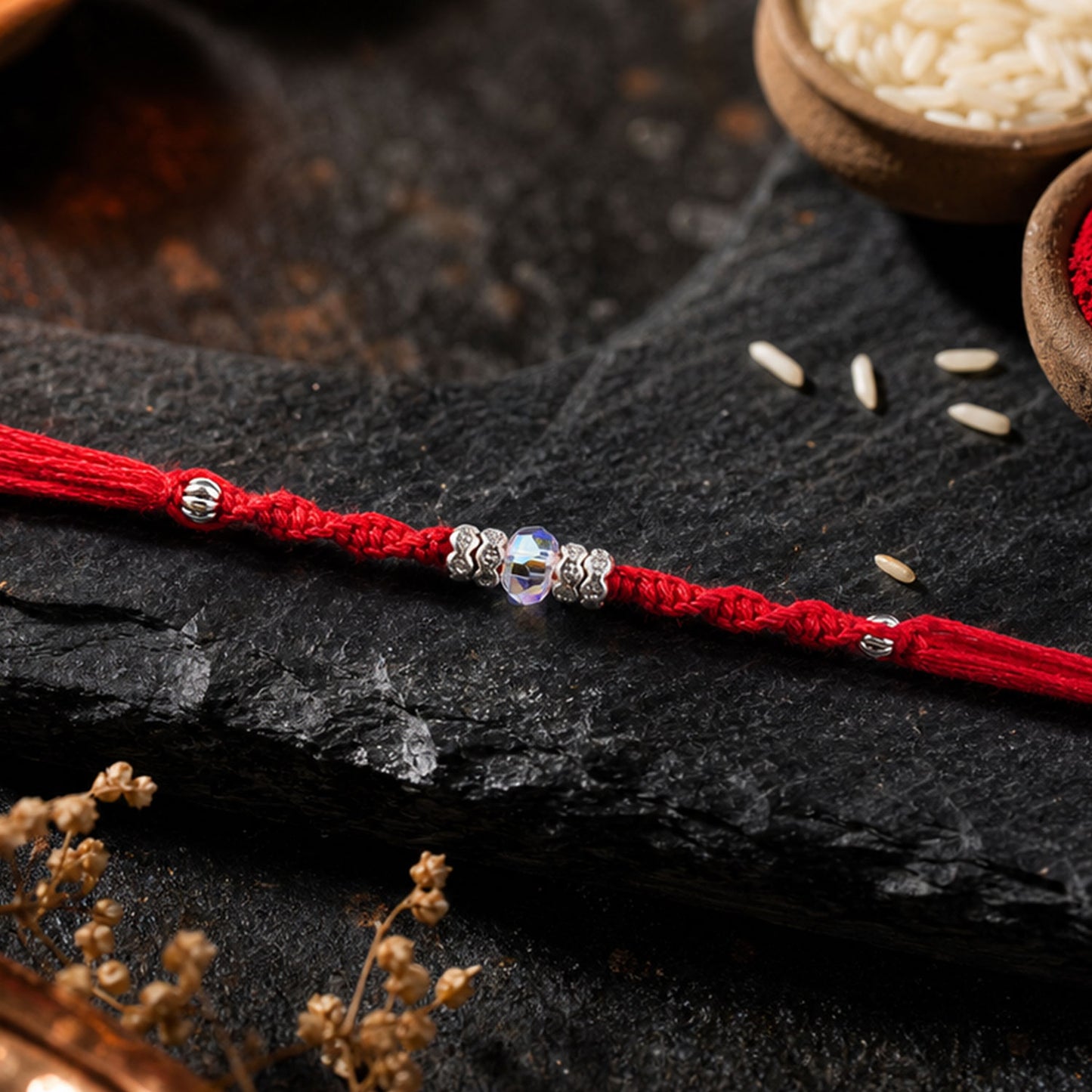 Red Braided Rakhi with a Row of Sparkling Crystal Bead Accents