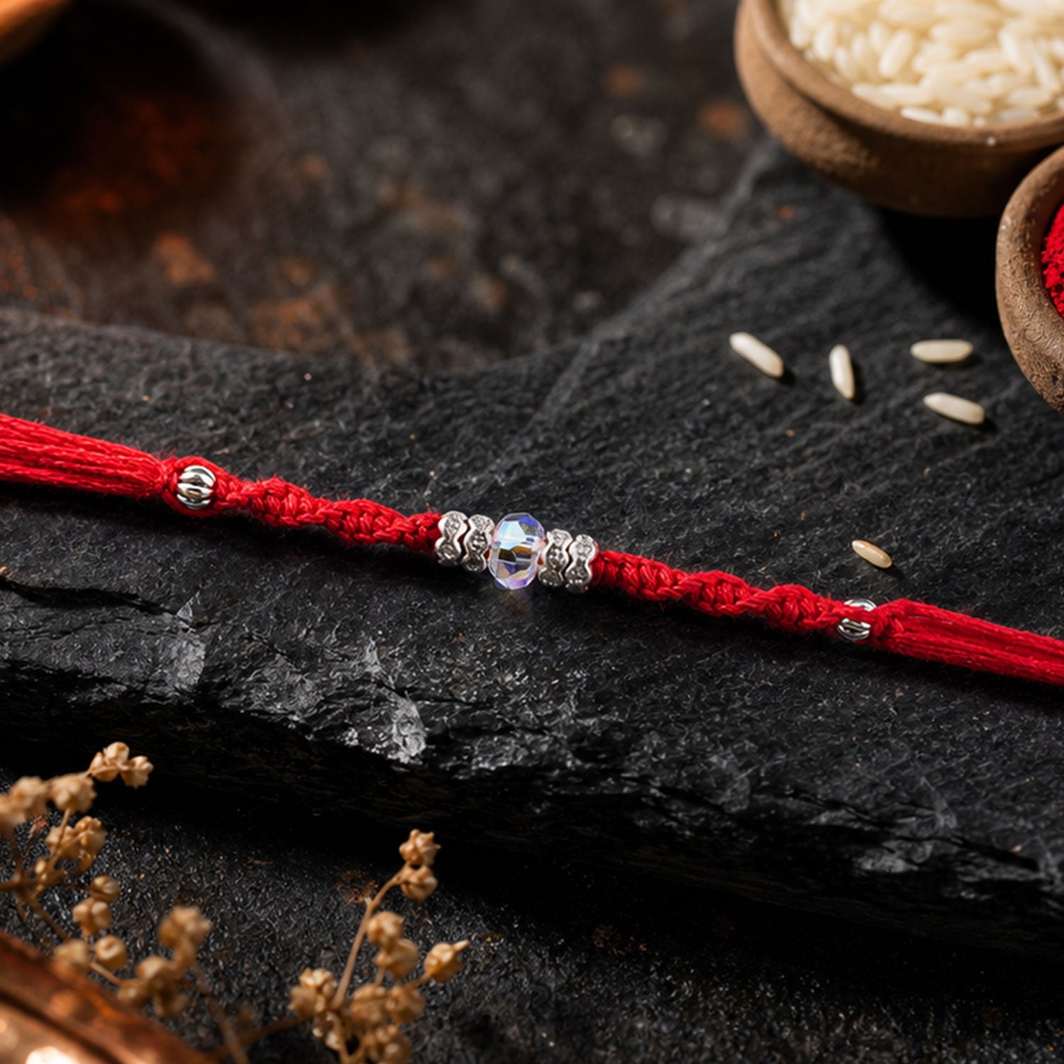 Red Braided Rakhi with a Row of Sparkling Crystal Bead Accents