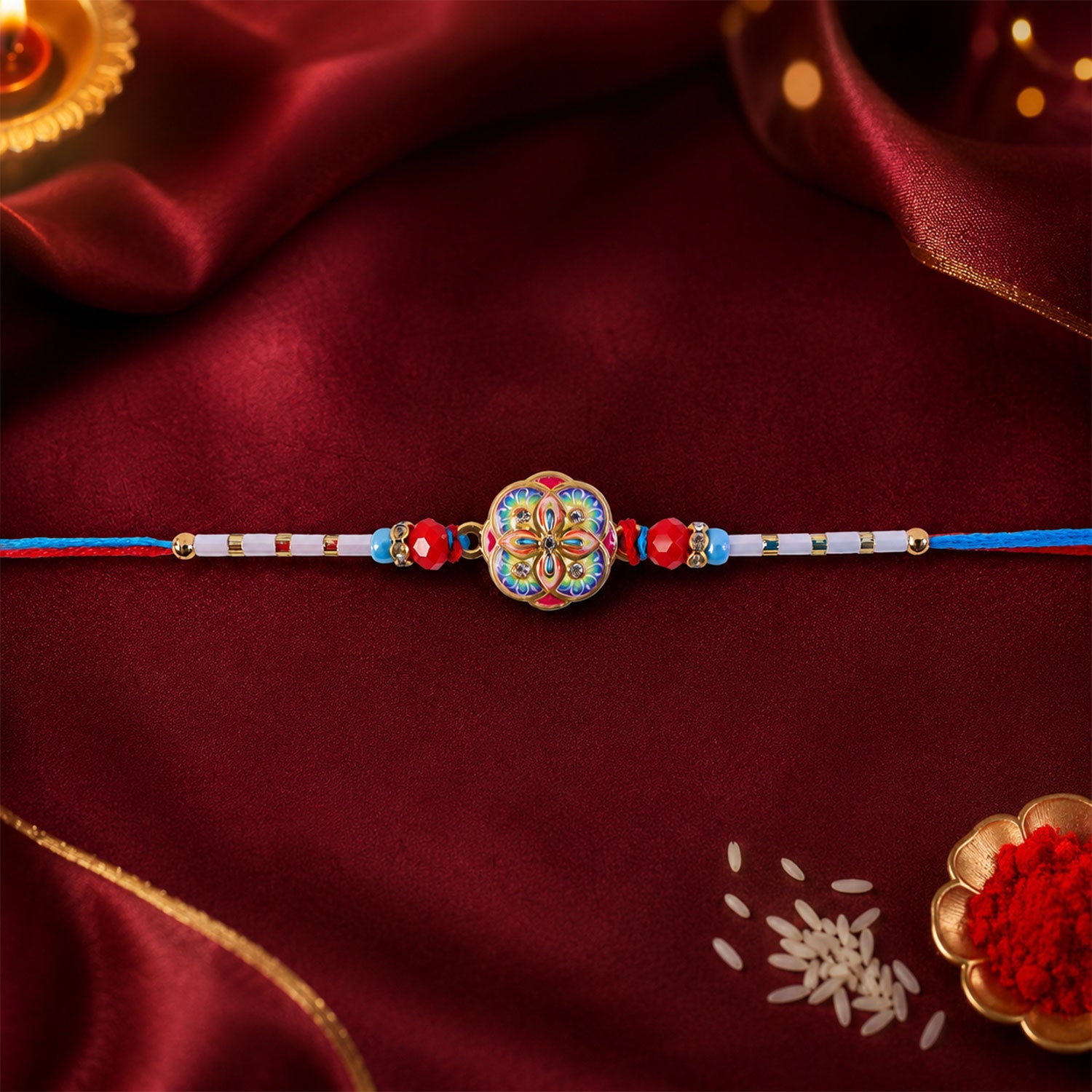 Colorful Kundan Round Rakhi with Red Beads and Blue Thread Edges