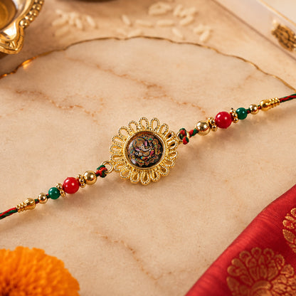 Hand Painted Ganesha Medallion Rakhi with Red Beads
