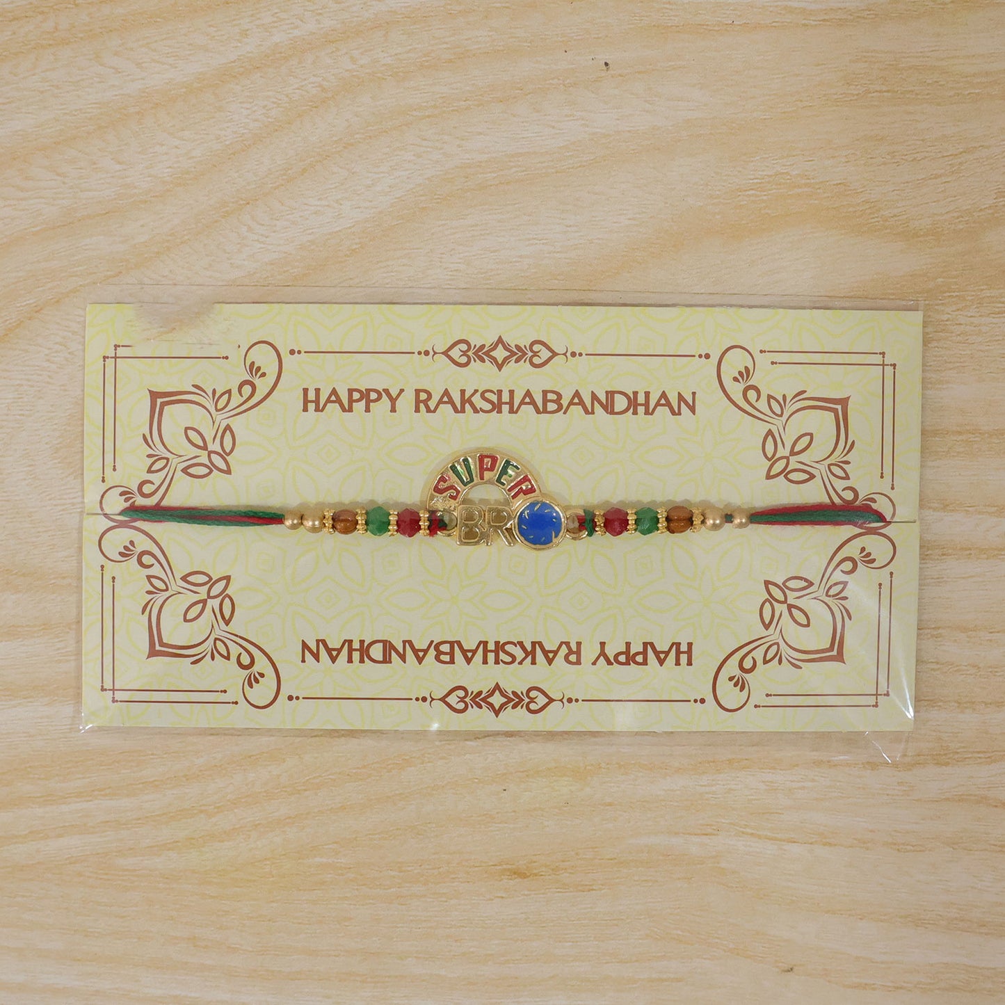 Super Bro Golden Rakhi with Colorful Beads, Blue Charm and Premium Festive Look