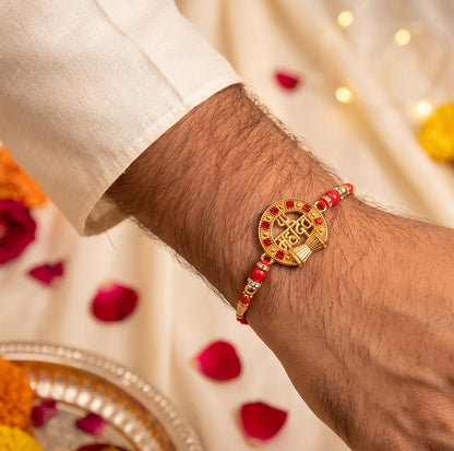 Mahadev Trishul Damru Round Rakhi with Red Pearls and Premium Center