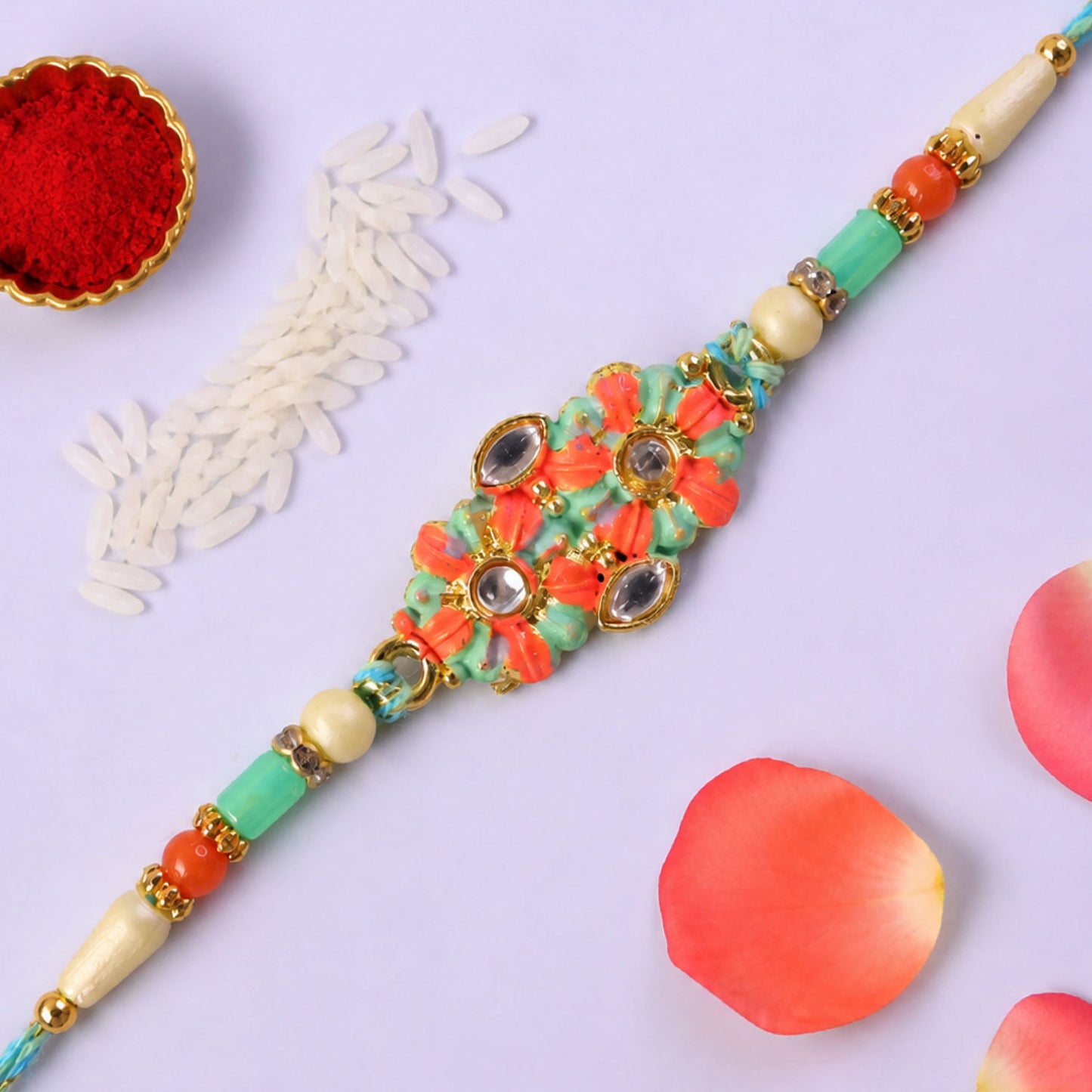 Marigold Style Floral Kundan Pendant Rakhi with Teal Beads
