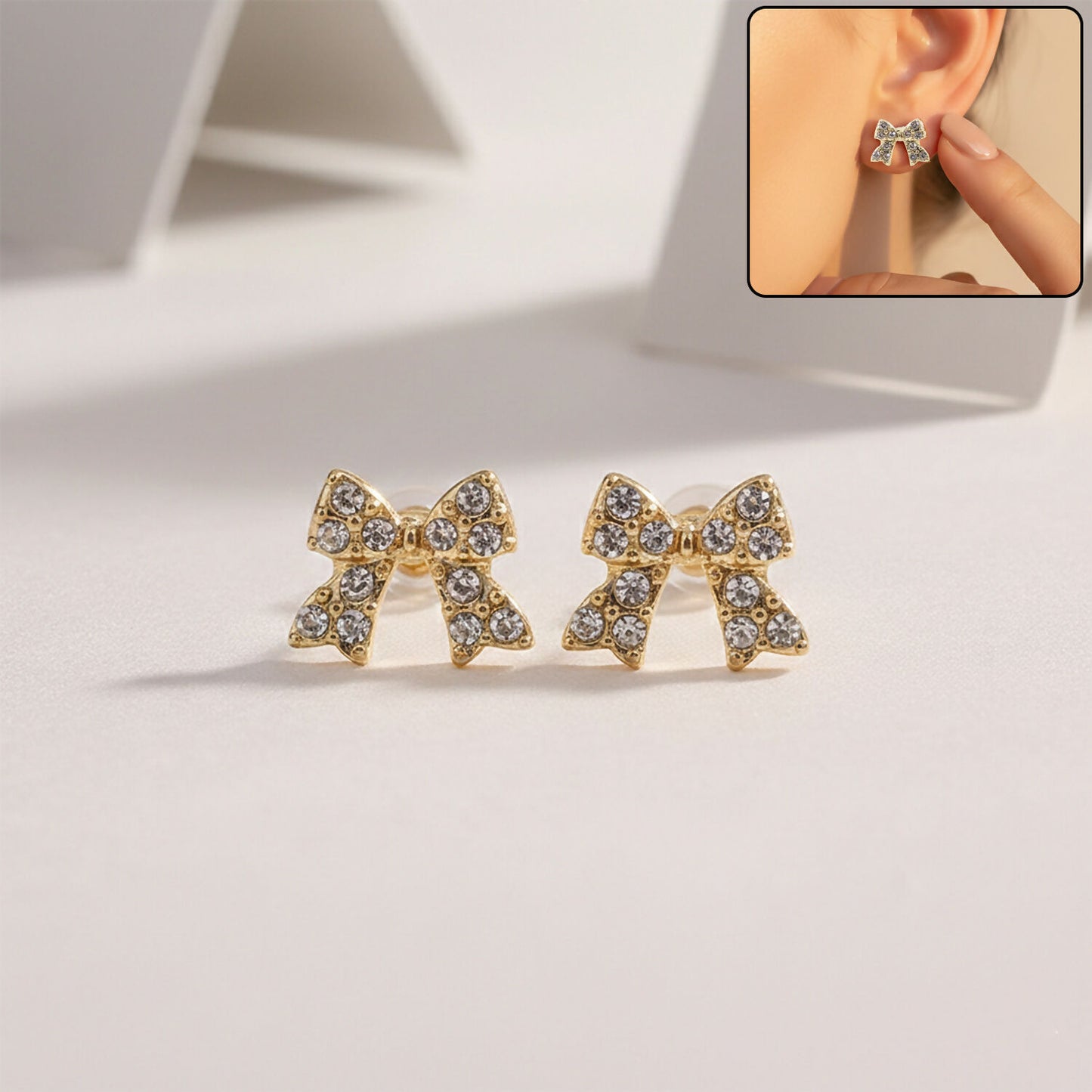 Gold plated crystal bow stud earring front view