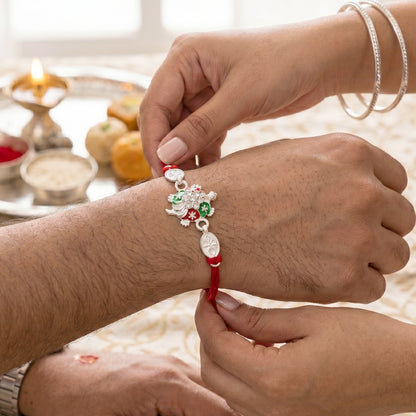 Turtle Rakhi with Red Thread and Crystal Embellishments